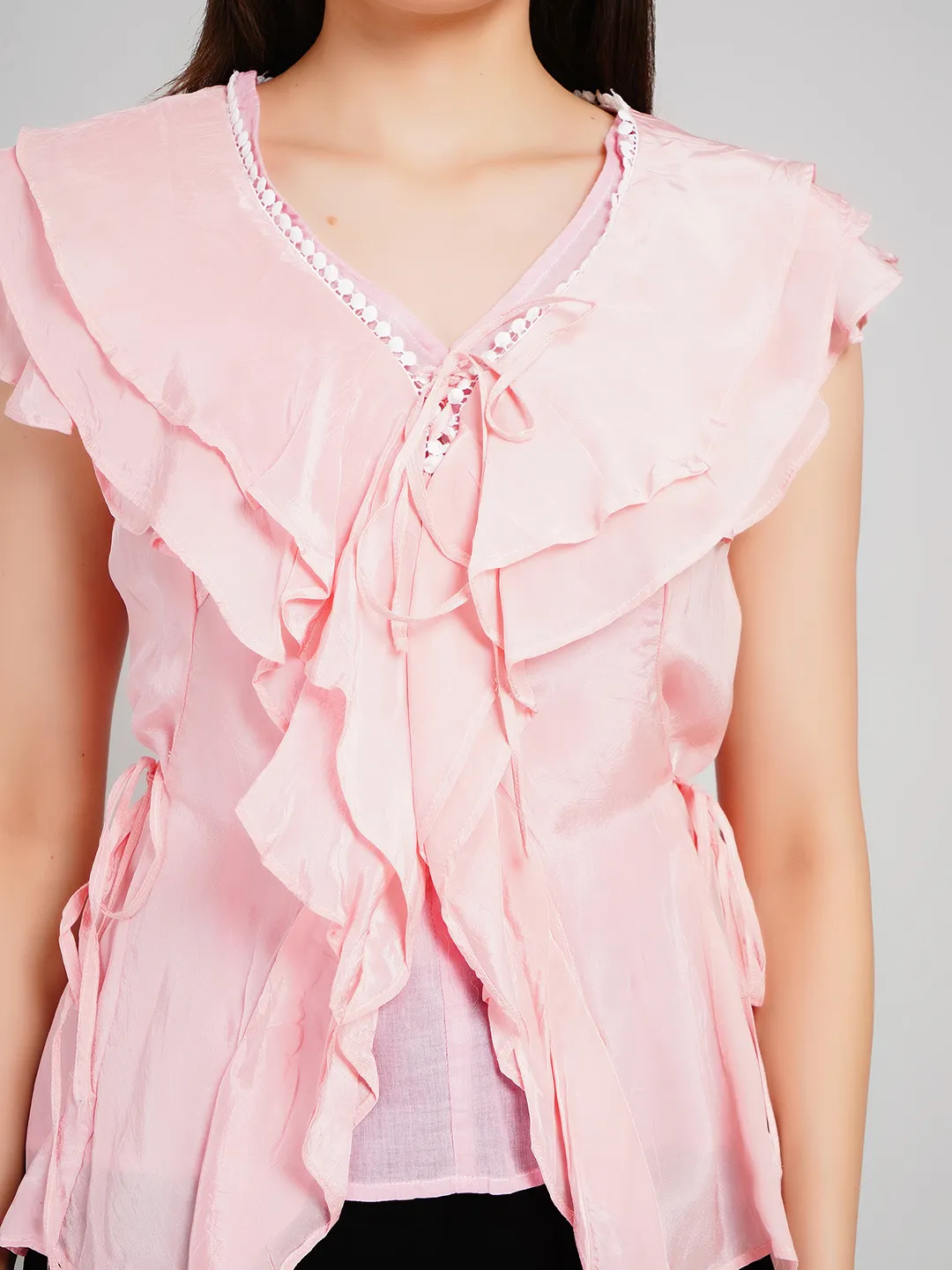 Women Pink Sleeveless Peplum Top with Draped Ruffles and Tie-Up Detail