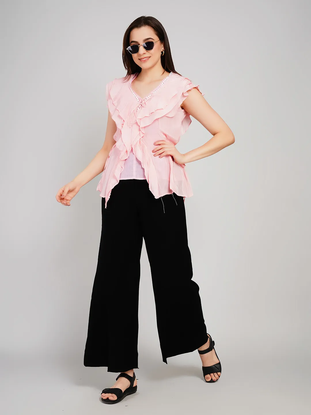 Women Pink Sleeveless Peplum Top with Draped Ruffles and Tie-Up Detail
